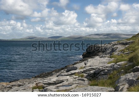 Rocky coast of an Atlantic bay in The Burren, famous natural landmark of Ireland. County Clare, West Coast of Ireland