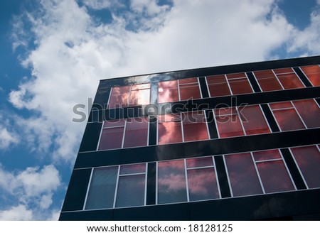 Modern high rise with cloud reflecting windows and black facade, Stadtwerke (Public Utility), Bochum, Northrhine-Westphalia, Germany
