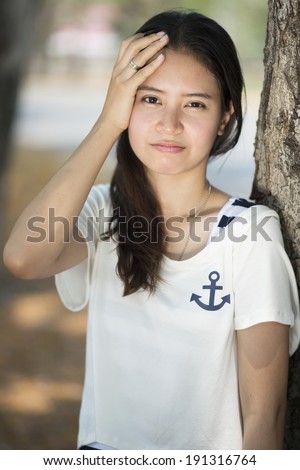 Portrait of stressed woman with a headache, stress, migraine