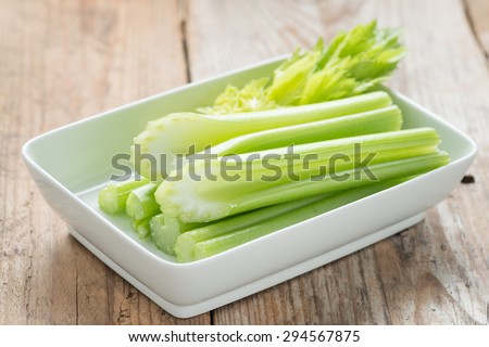 Fresh celery stick on white dish