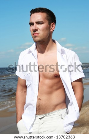 stock photo sexy young guy on the beach Save to a lightbox 