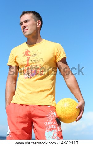 pretty guy with yellow ball