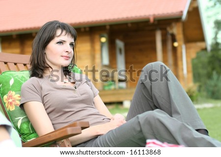 cute young girl relaxing in summer cottage