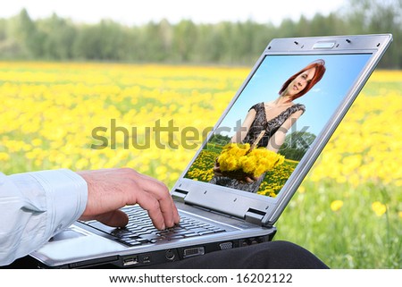 laptop with picture of beautiful girl on desktop