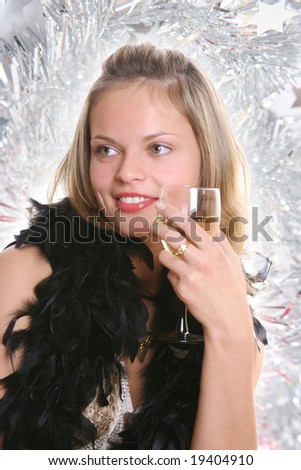beautiful young woman drinking champagne on christmas party