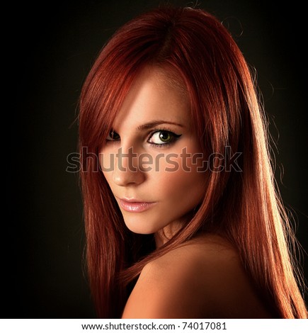 beautiful young woman on dark background