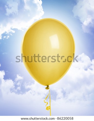yellow balloon on blue sky