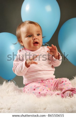 funny little girl with blue balloon