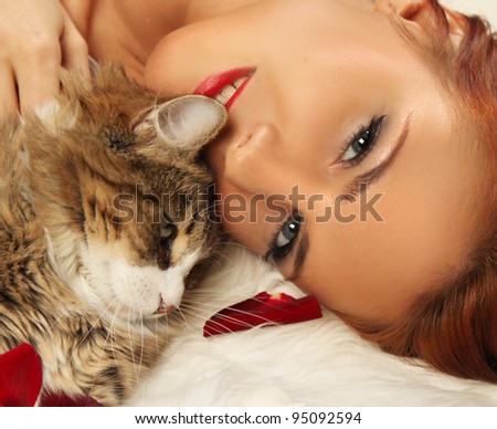 cute woman with cat on fur