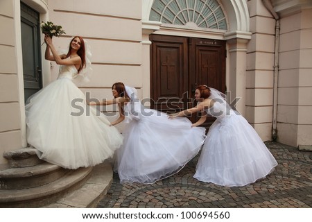 three beautiful brides having fun