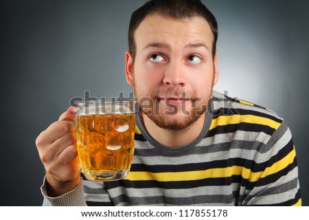 happy young guy drinking beer