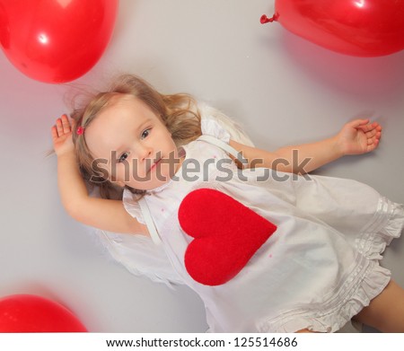 cute little angel-girl with red heart