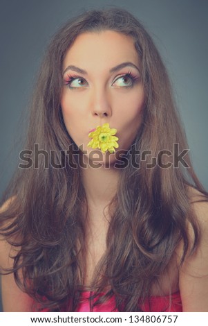 funny young woman with flower