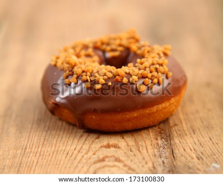 sweet bright donut on wooden background