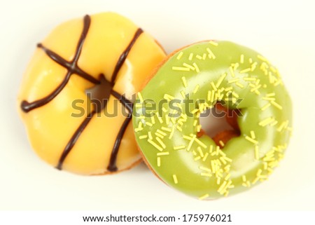 sweet bright donuts on white
