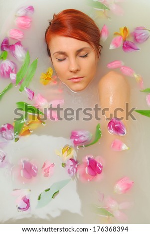 woman in bath with flowers