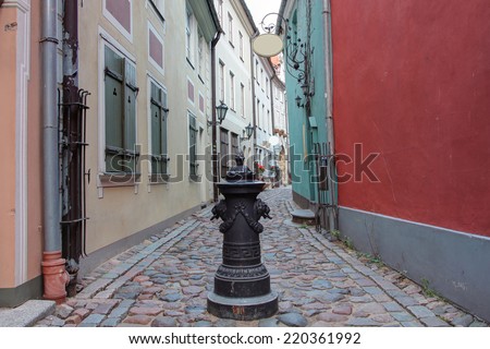 Narrow medieval street in old city of Riga, Latvia. In 2014, Riga is the European capital of culture