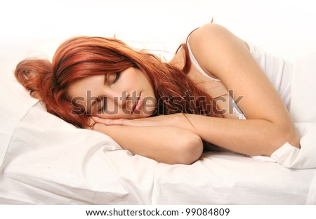 beautiful young woman sleeping in bed