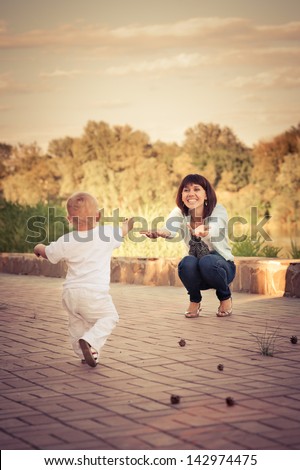 little boy running to meet mom