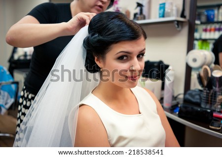 Bride in a beauty salon on the make-up