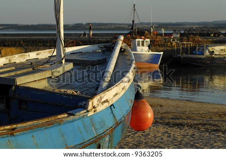 Beadnell Harbour at sunset. Englands only easterley facing harbour on the east coast of England