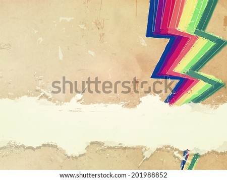 retro background with drawn rainbow zigzag lines and text space over old paper