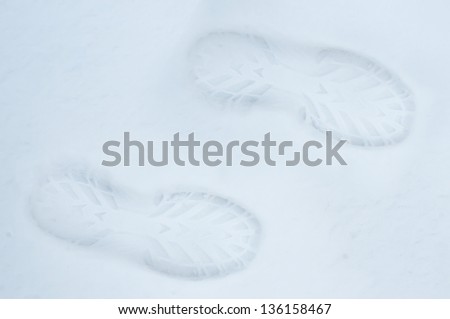 human footprint in the snow, two legs, the top view