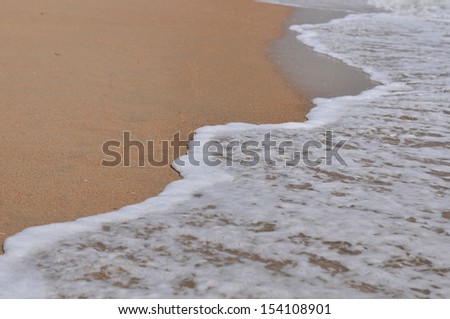 Sea wave over sand, sea Ã?Â¢??Ã?Â¢??wave rolls on a sandy beach