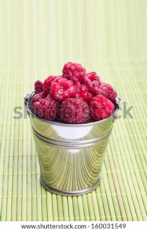 beautiful raspberries in bucket, background, food, fruit,