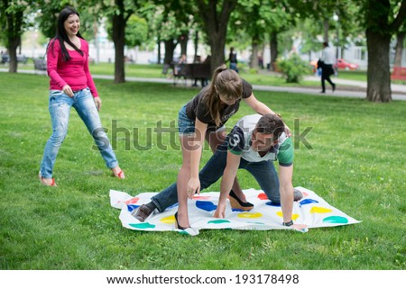 Students play a game in the park twister