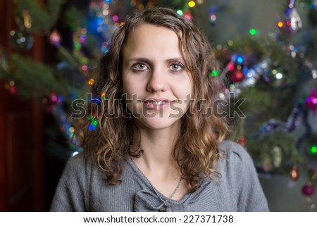 Happy Christmas - Little girl and Christmas tree (Defocused Christmas Tree Lights)