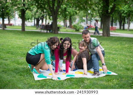 Students play a game in the park twister, beautiful, indoor, little, happy, kindergarten