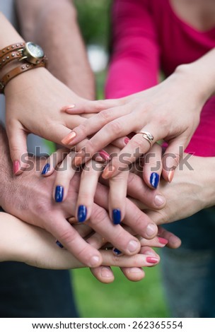 Hands in. Closeup of pile of hands of a business team showing unity
