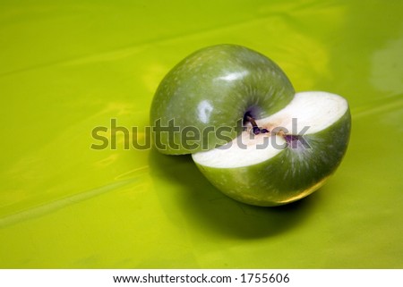 half apple ,vivid green background