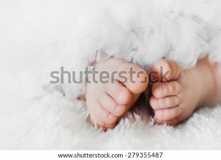 Baby feet on a lace skirt/Baby feet/Baby feet