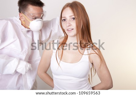 Portrait of a young attractive male laboratory technician checking patient.