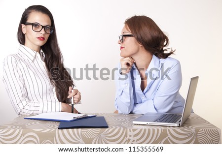 Portrait of a two young beautiful female secretaries.