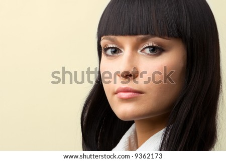 portrait of confident brunette woman with copyspace