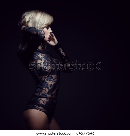 stock photo gorgeous blonde in lace dress isolated on black studio shot