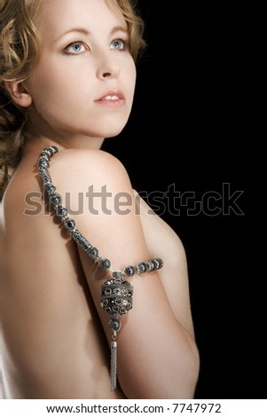 stock photo Beautiful young nude girl with necklace posing in studio