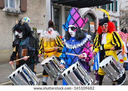 Riehen, Switzerland - Feb 16: Carnival Parade On February 16, 2012. A Colorful Parade Of Carnival Masks In The Town Of Riehen Revives A Centuries Old Tradition Of Masked And Costumed Performances.