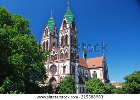 Jesus Sacred Heart Church in Freiburg in Breisgau, Germany. It is a catholic church with a polychrome exterior and it was built with a double tower imitating the cathedral in Limburg.