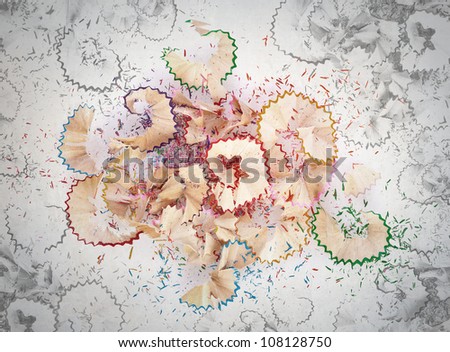 Colorful pencils crayons shavings after sharpening concept background