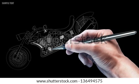 hand with the pencil drawing cad . engineer working on  concept  motorcycle