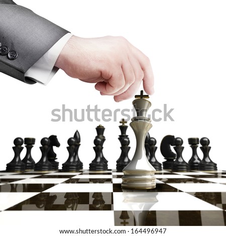 Strategy concept. hand holding white chess figure on chess board  isolated on white background High resolution