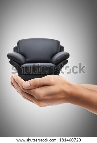 Man hand holding object ( modern leather chair ) High resolution