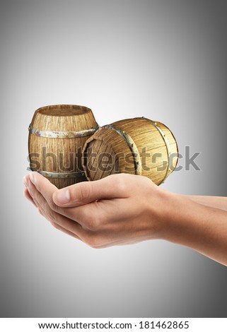 Man hand holding object ( Wooden barrels )  High resolution