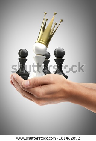 Man hand holding object ( Pawn in a golden crown )  High resolution