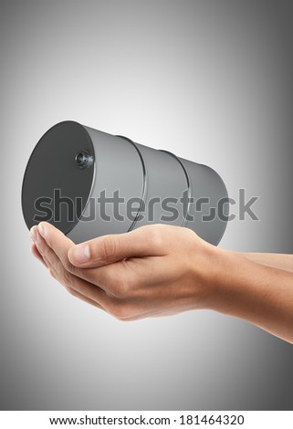 Man hand holding object ( black FUEL barrel ) High resolution