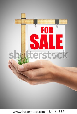 Man hand holding object ( For sale sign )  High resolution